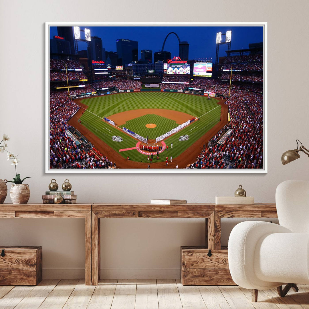 A Cardinals wall art canvas print depicts Busch Stadium with players lined up on the field and a full audience under the lights, capturing the vibrant atmosphere.