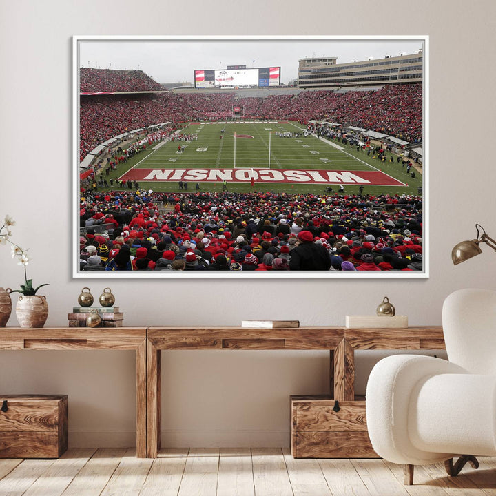 The wall art depicts WISCONSIN in red and white, similar to Wisconsin Badgers Football Canvas Art.