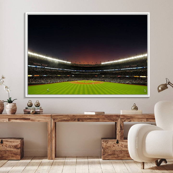 A night game at Yankee Stadium depicted on canvas beneath a sunset sky.