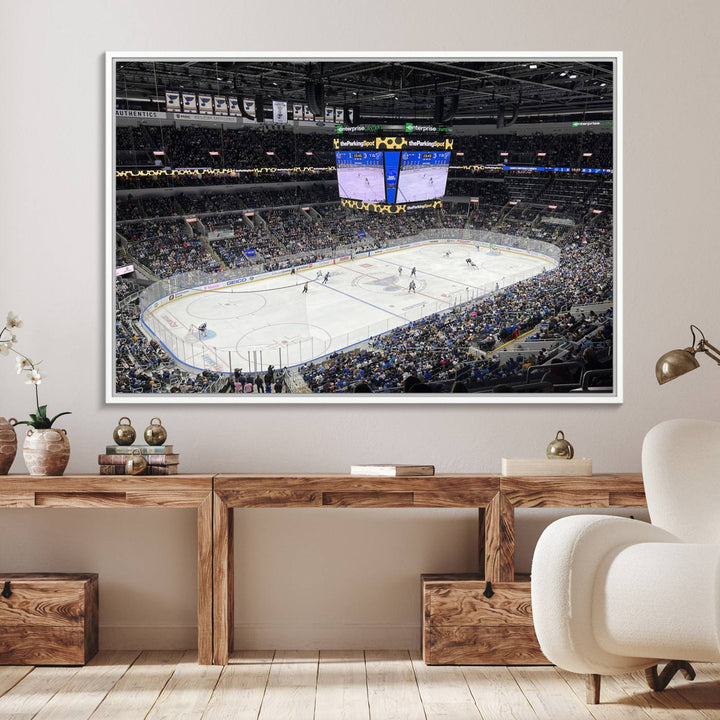 A large Enterprise Center canvas of a crowded hockey arena hangs prominently.