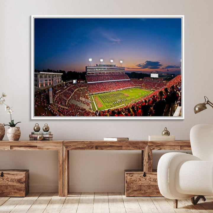 A vibrant and dynamic painting captures the essence of an electrifying night game at Carter-Finley Stadium, highlighting the illuminated atmosphere as the NC State Wolfpack competes under bright stadium lights.