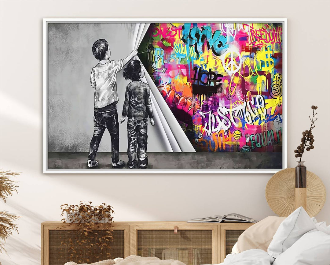 The Banksy Print - Street Art Canvas features a vibrant and bold image of two children lifting a curtain to reveal colorful graffiti. It's ready to hang, adding an urban modern decor vibe.