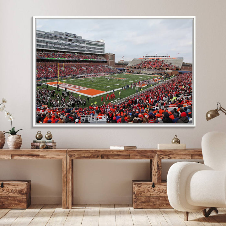 A University of Illinois Fighting Illini wall art canvas hangs on the wall, depicting a packed stadium.