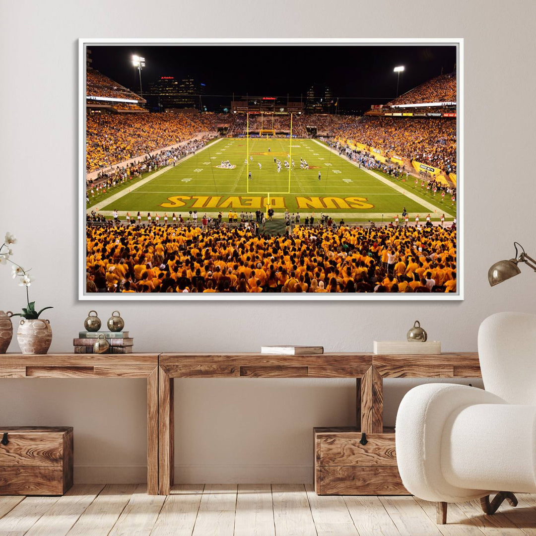 The Phoenix Stadium Canvas Wall Art features a vibrant depiction of a packed stadium filled with ASU Sun Devils fans wearing yellow shirts.