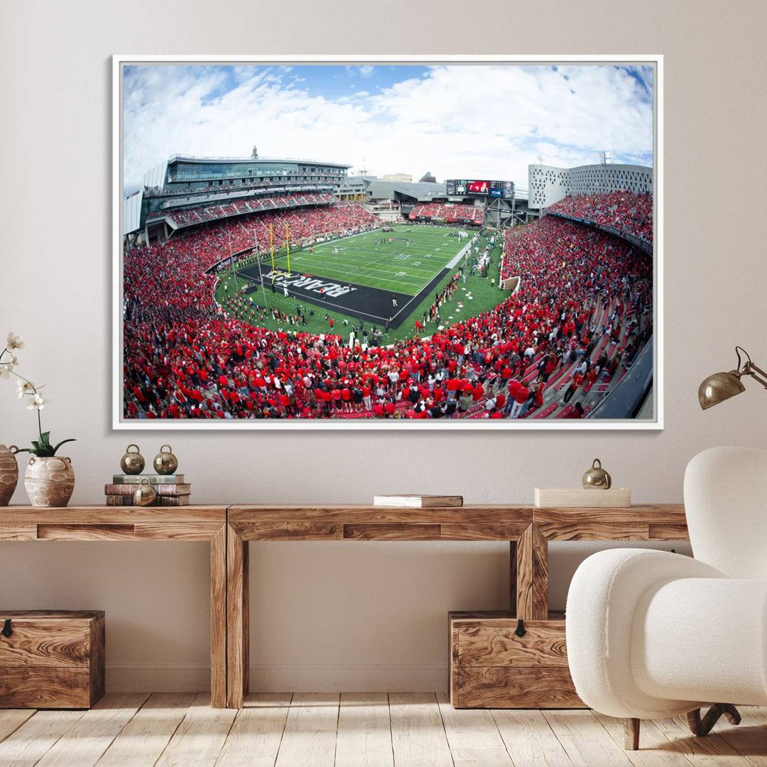 The wall showcases a Nippert Stadium canvas print of the Cincinnati Bearcats.