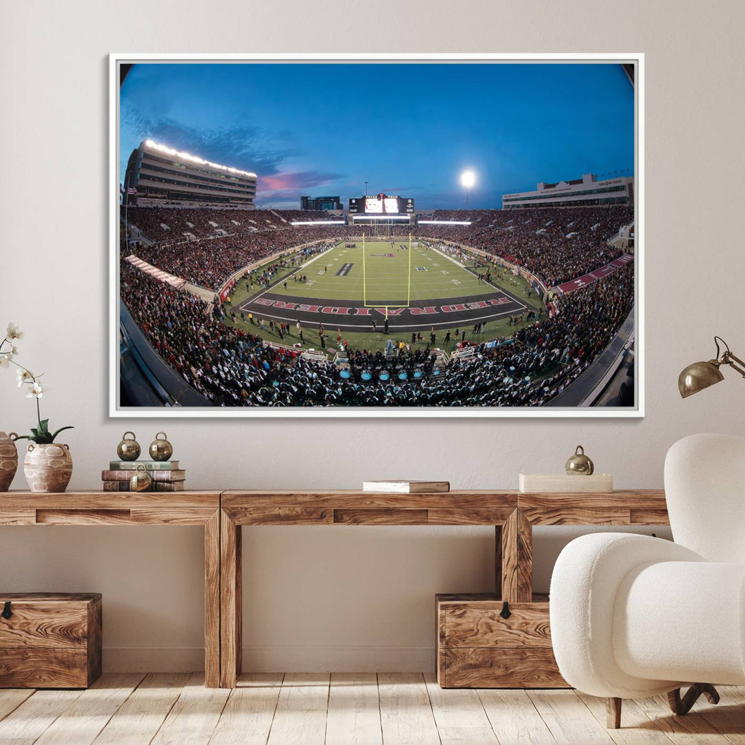 The wall art in the living room features a Texas Tech Red Raiders Football Team Print, showcasing Jones AT&T Stadium at dusk.