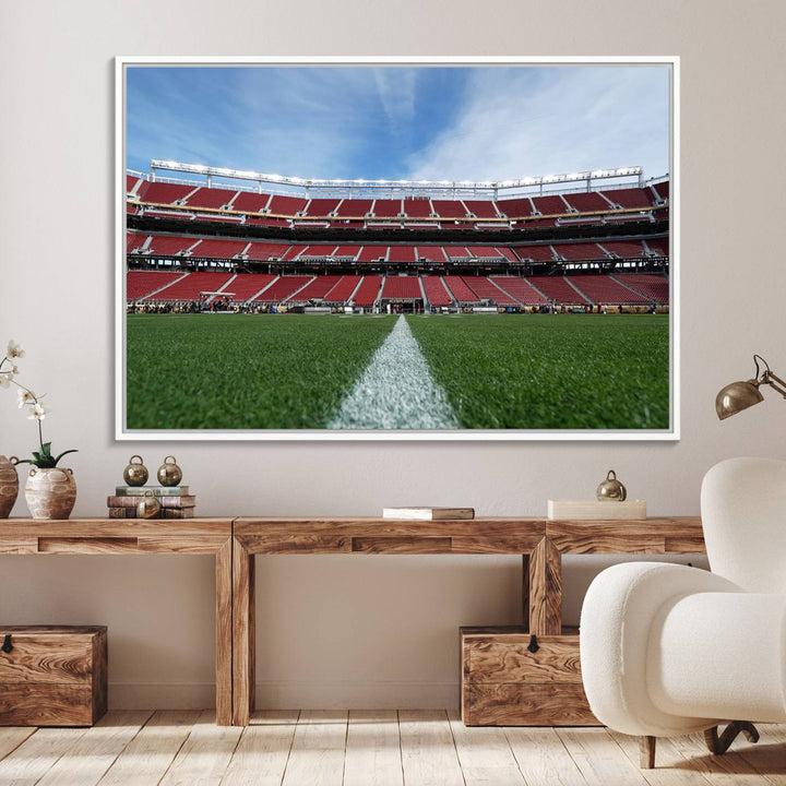 A canvas print of the University of Tulsa Golden Hurricane showcases H.A. Chapman Stadiums football field and red seats against a backdrop of a blue sky.