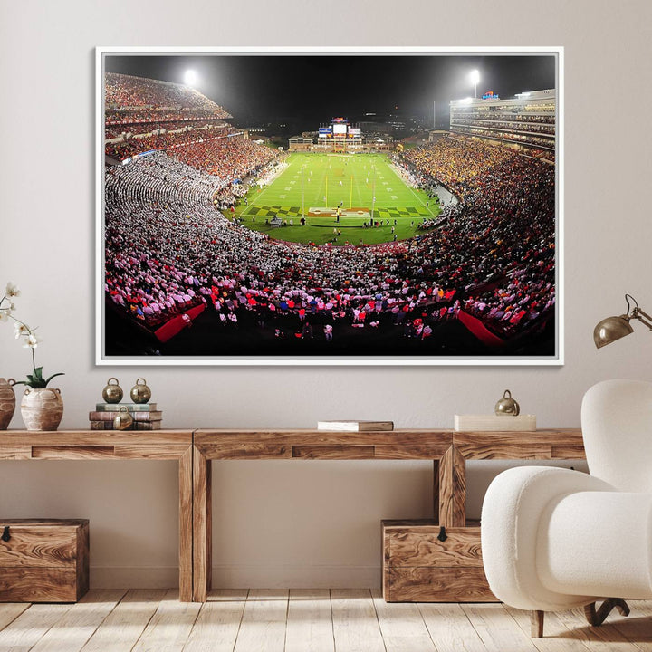 The Maryland Terrapins Football Wall Art Canvas showcases a packed SECU Stadium at night with a bright field and cheering fans.