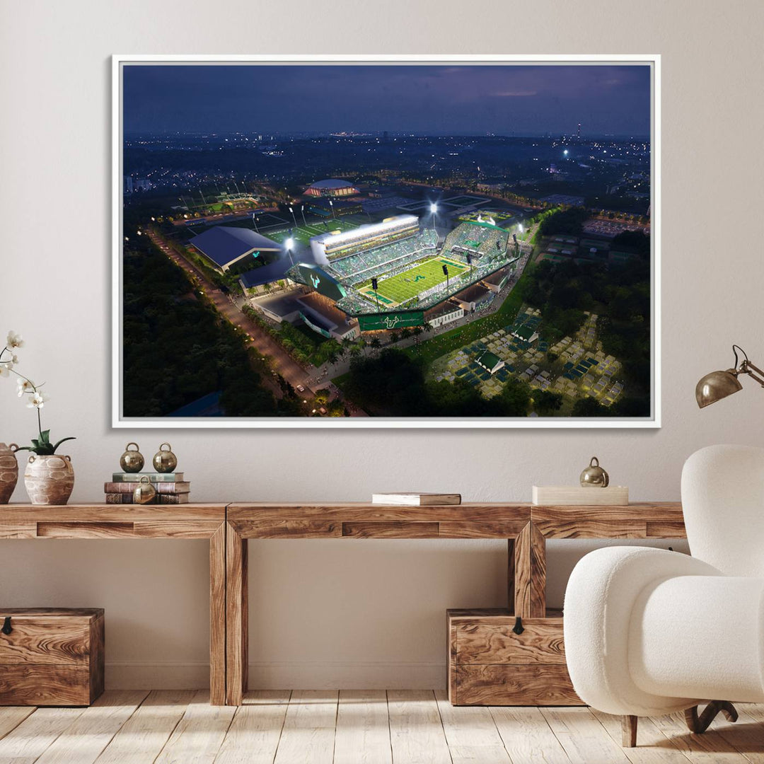 The USF Bulls Football Team Wall Art Canvas Print showcases the Tampa USF Football Stadium at night with city lights.