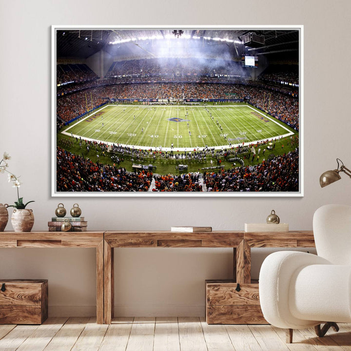 The modern living room features an Alamodome wall art canvas print, depicting a stadium filled with spectators for a UTSA Roadrunners game.