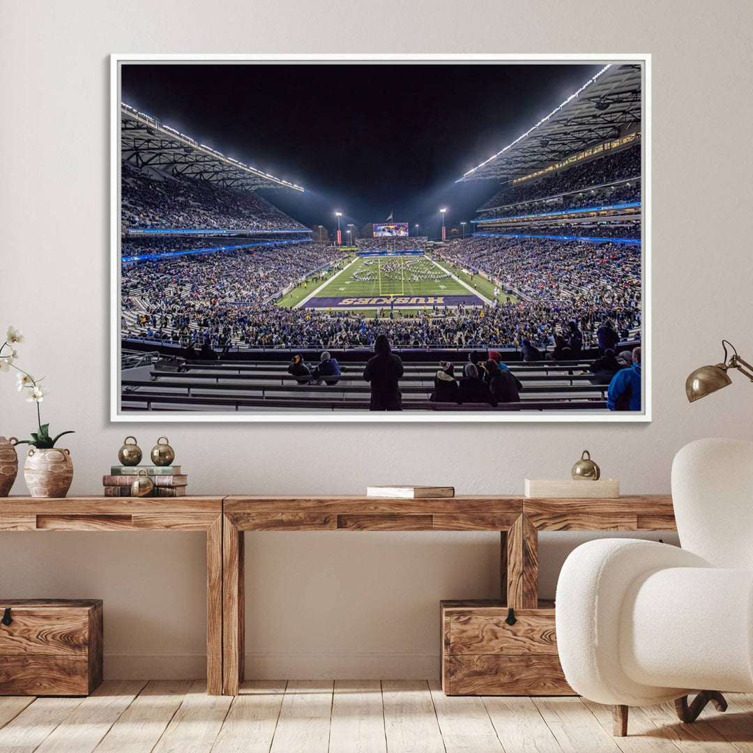 A canvas print titled The University of Washington Huskies Football depicts a packed Husky Stadium at night, as seen from the stands.