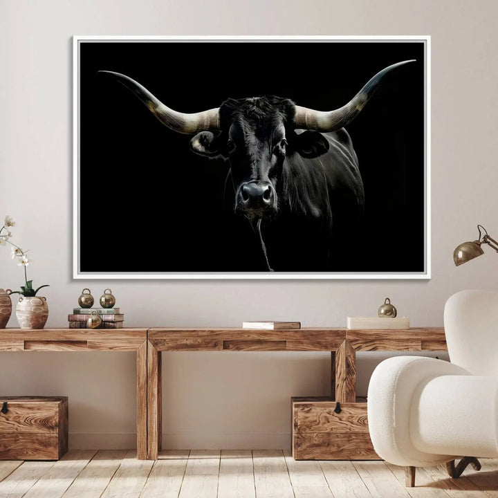 A captivating close-up canvas print of a Texas Black Longhorn with impressive curved horns set against a dark backdrop, ideal as a standout piece in your collection of Longhorn Cow Wall Art.