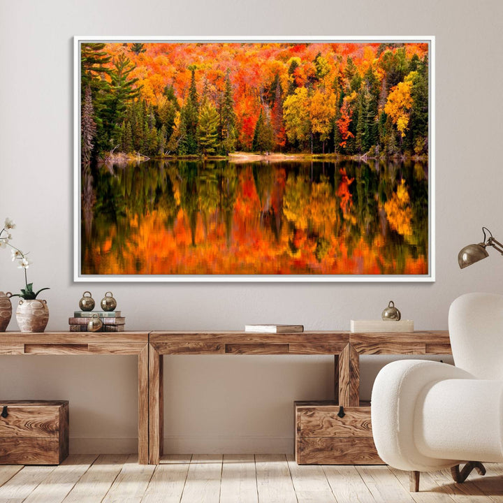 Autumn Forest Reflection Wall Art: a vibrant triptych canvas featuring fall foliage with red, orange, and yellow leaves over a calm lake.