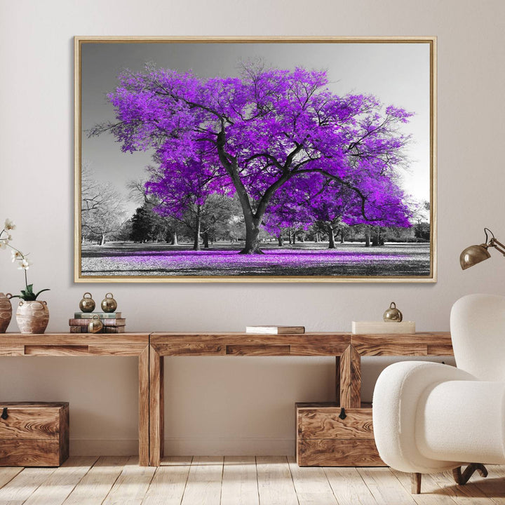 The Big Purple Tree Wall Art Canvas Print showcases a vibrant purple tree set against a black-and-white landscape.