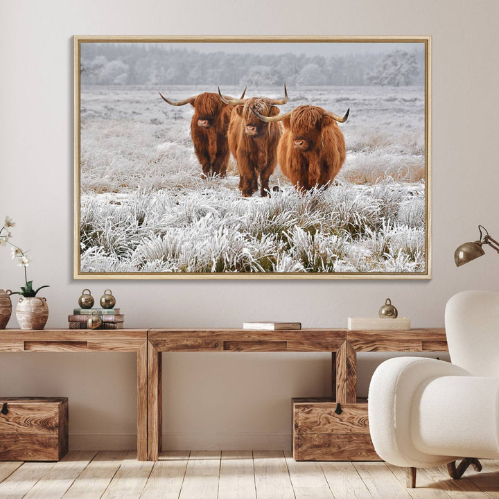 The Highland Cows in Snow canvas showcases three cattle in a frosty field.