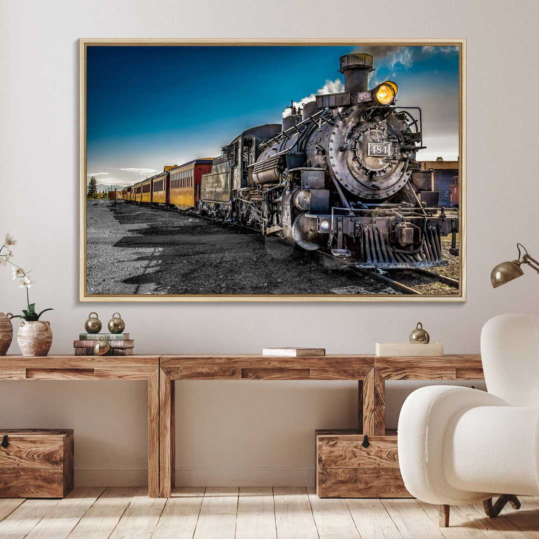 The Train Wall Art Canvas Print features a vintage steam train with a bright headlight.