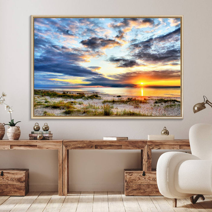 The Sunset On The Ocean canvas wall art features a beautiful beach sunset with grass and clouds.