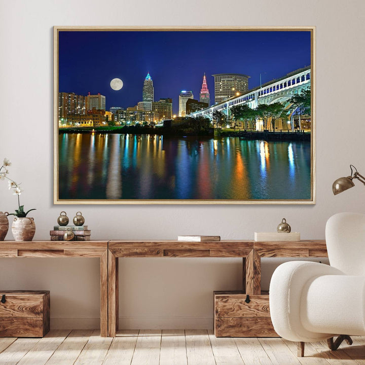 Cleveland City Lights Night Skyline Wall Art canvas showcases a moonlit cityscape reflected on water.