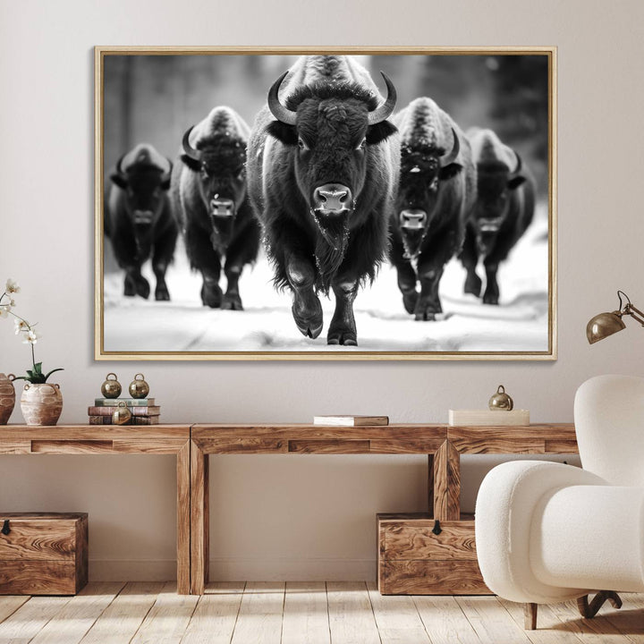 A black and white American Bison herd canvas print adorns the wall.