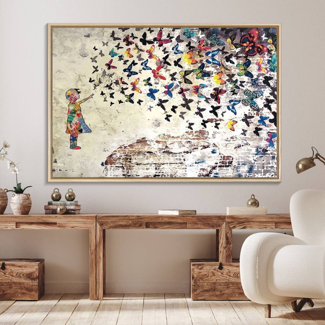 A Banksy Girl Butterfly Canvas Print is displayed on the textured wall.