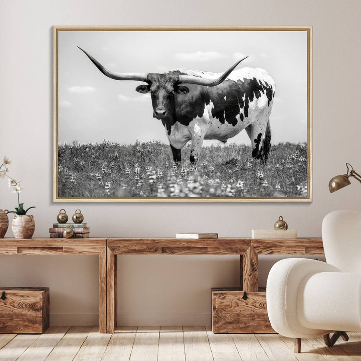 Texas Black White Highland Longhorn Cow Wall Art Canvas displayed on the wall.