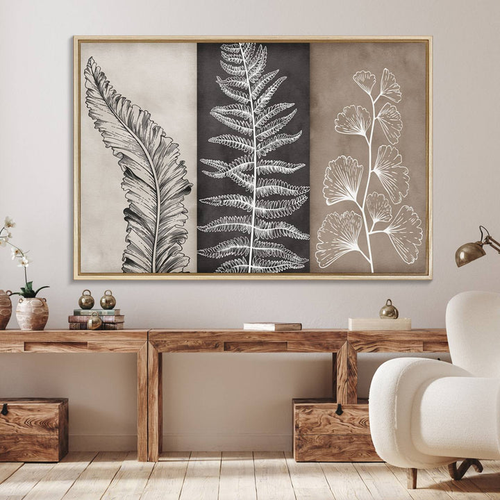 Three framed botanical wall art pieces are displayed in a bright room.