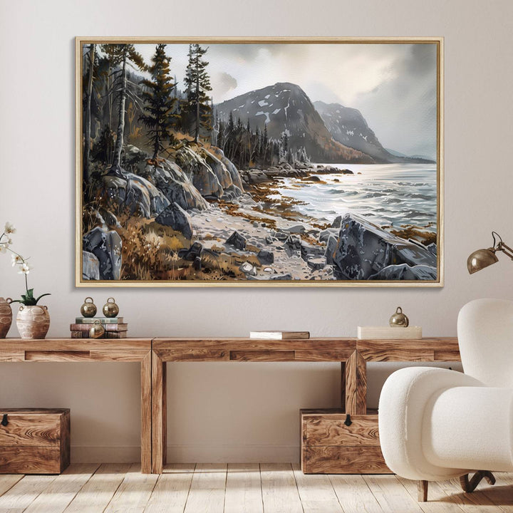 Framed wall art depicting Acadia National Parks rocky coast, trees, mountains, and sunlight over the sea; ready to hang.