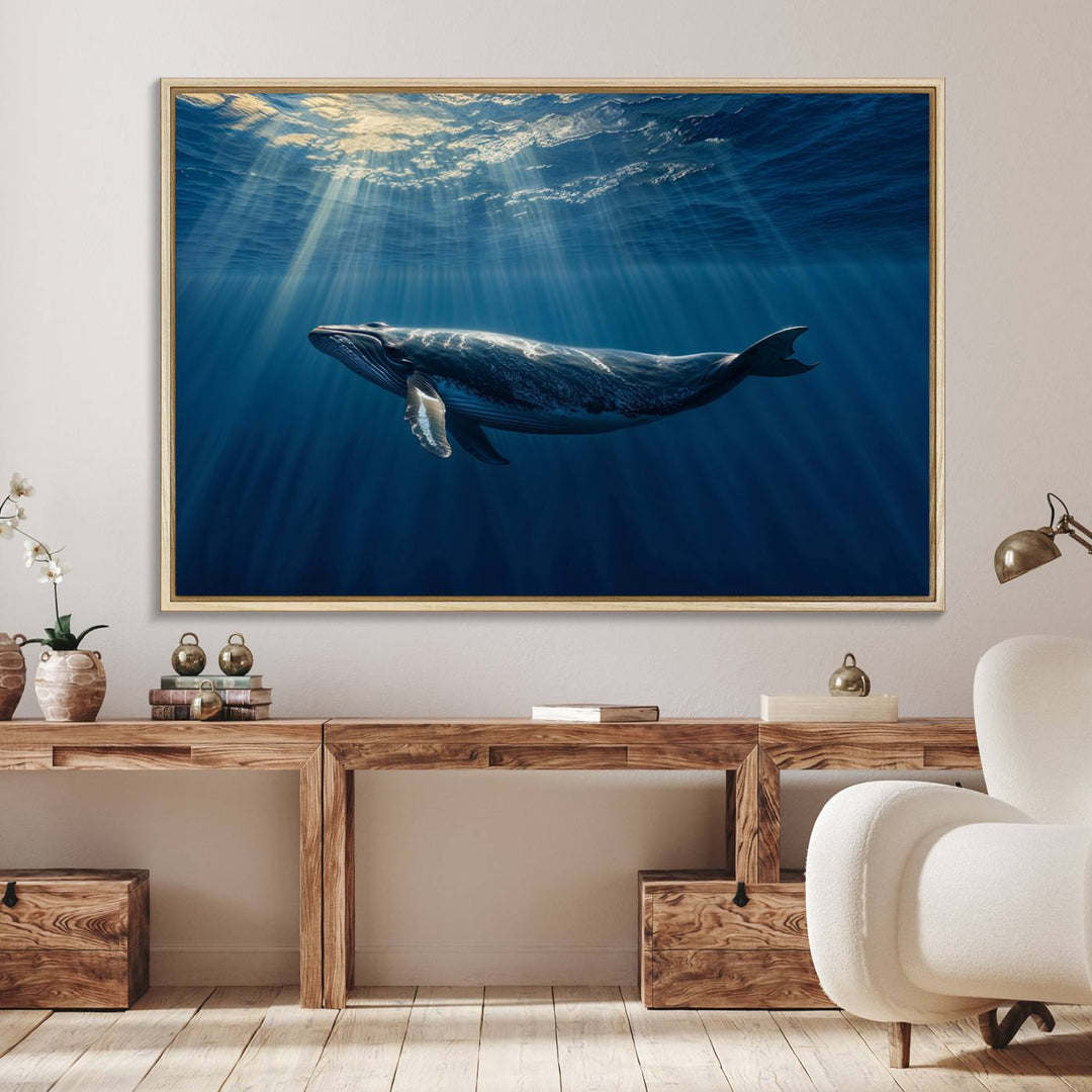 The Whale under Ocean wall art canvas print graces the white wall.