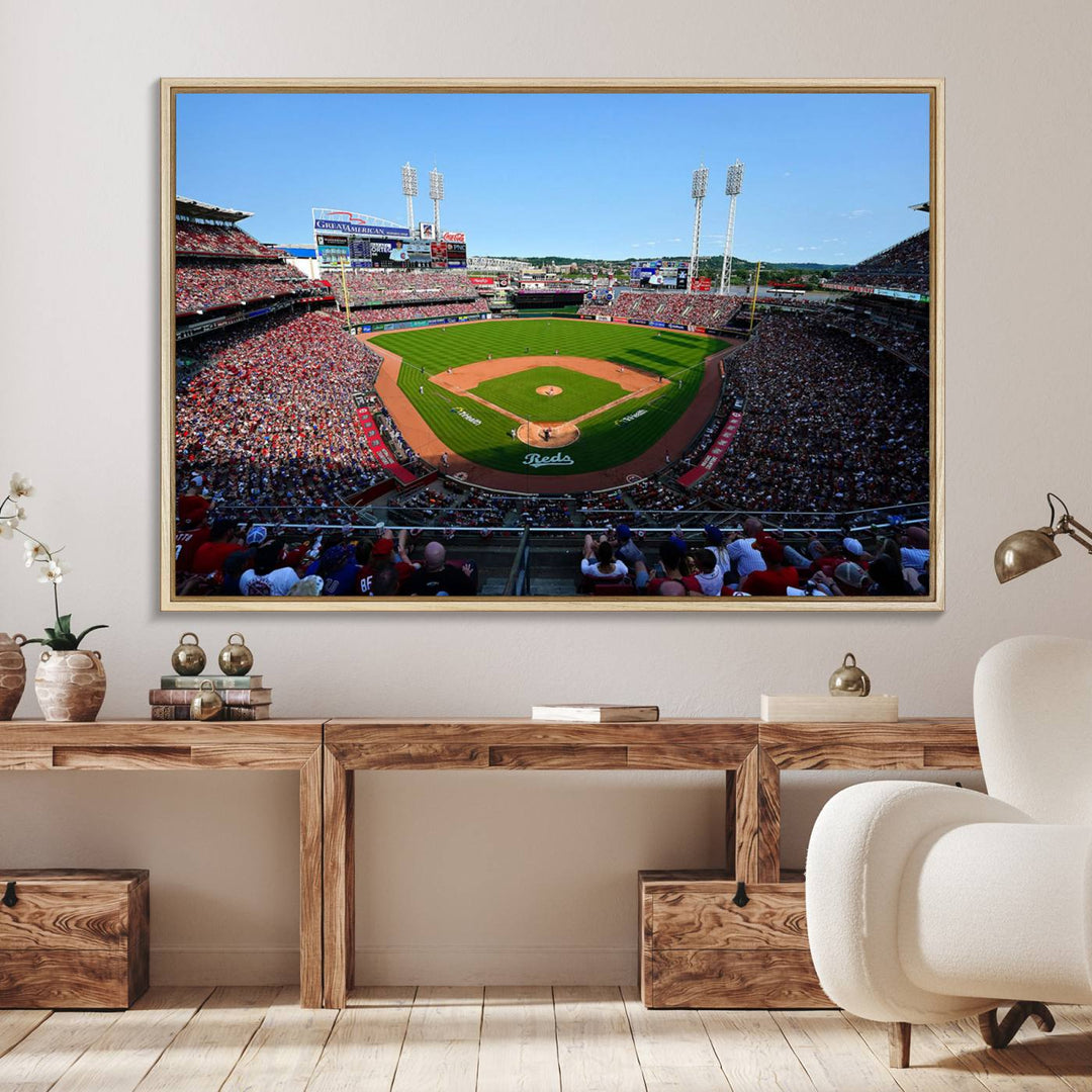 The Cincinnati Reds Baseball Team print of Great American Ball Park Stadium adorns the wall.