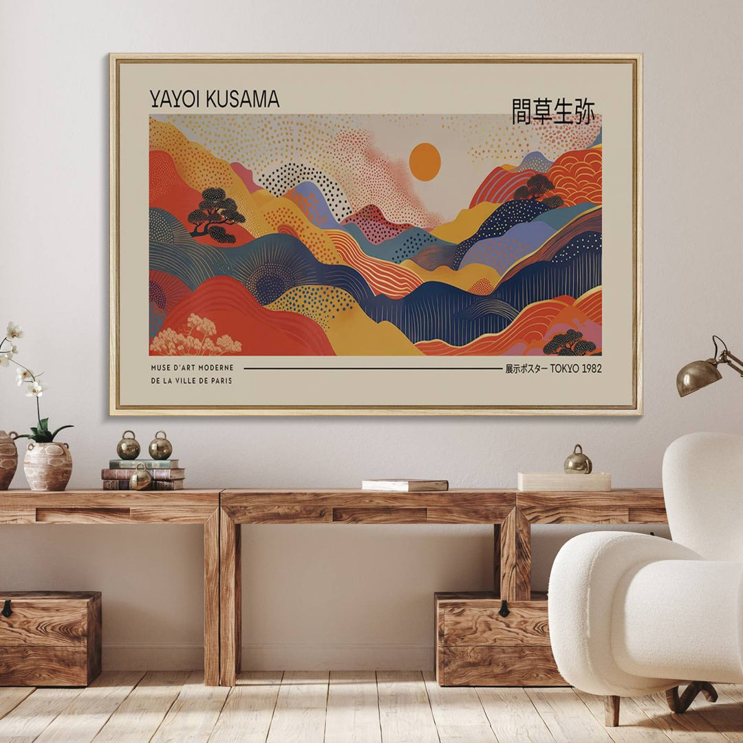 The Yayoi Kusama vibrant landscape canvas print featuring abstract mountains and a sun enhances the space with its modern aesthetic.