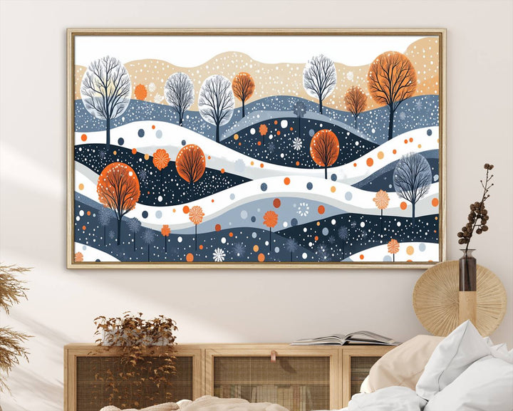 The "Abstract Winter Landscape Canvas Wall Art Print," featuring a triptych of landscapes with trees and hills in vibrant orange, white, and blue hues, adds a gallery-quality finish that transforms the space into an art lover's dream.