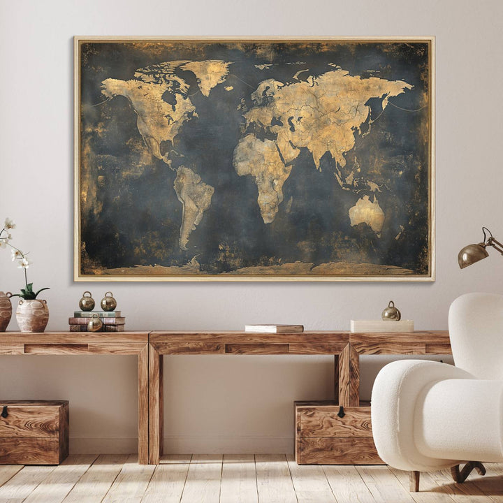 The Grunge World Map Canvas Wall Art features golden tones and is displayed against a white-paneled wall.