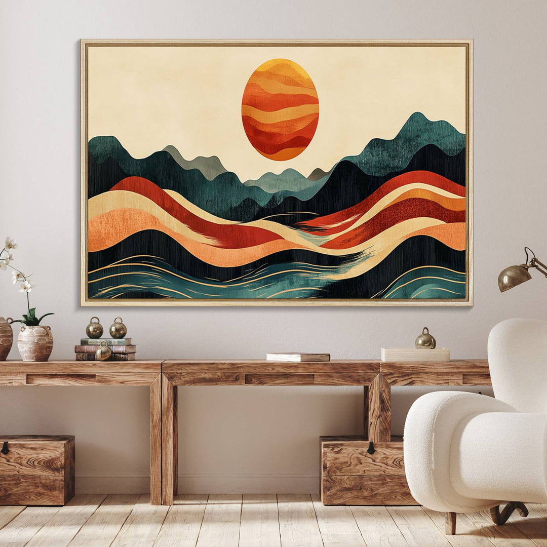 The Mountain Triptych wall art, featuring a design of the sun, mountains, and waves, is displayed prominently on the wall.