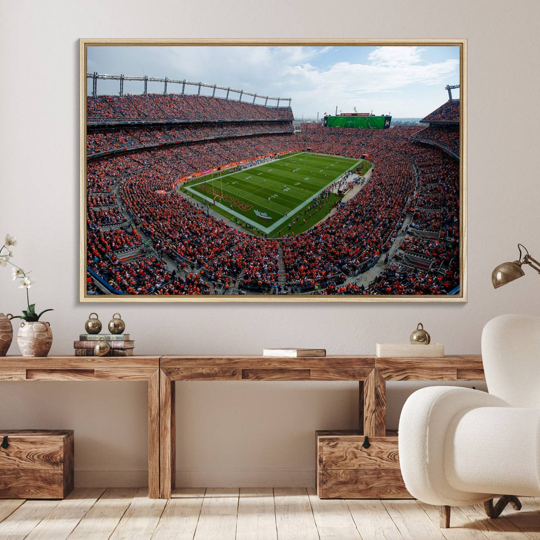 The Denver Broncos Football Print features a vibrant, fan-filled orange stadium overlooking the football field.