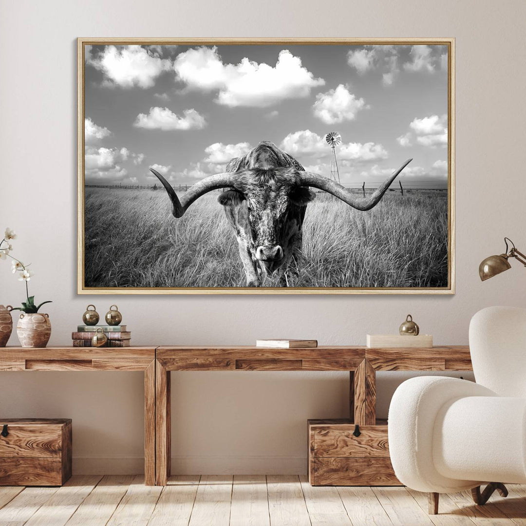 Longhorn Cow Field Canvas Print featuring rustic charm with a windmill backdrop.