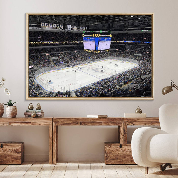 A large Enterprise Center canvas of a crowded hockey arena hangs prominently.