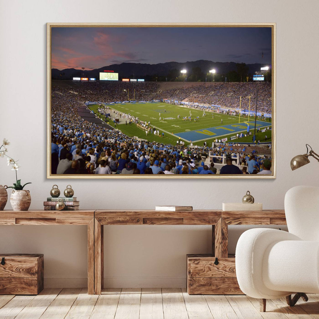 Admire the stunning wall art canvas depicting a UCLA Bruins game with a sunset over the Pasadena Rose Bowl Stadium.