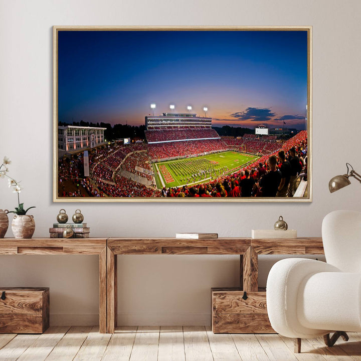 The Wolfpack Football Team Print captures a band and crowd at dusk in a premium canvas art style at Raleigh Carter-Finley Stadium.