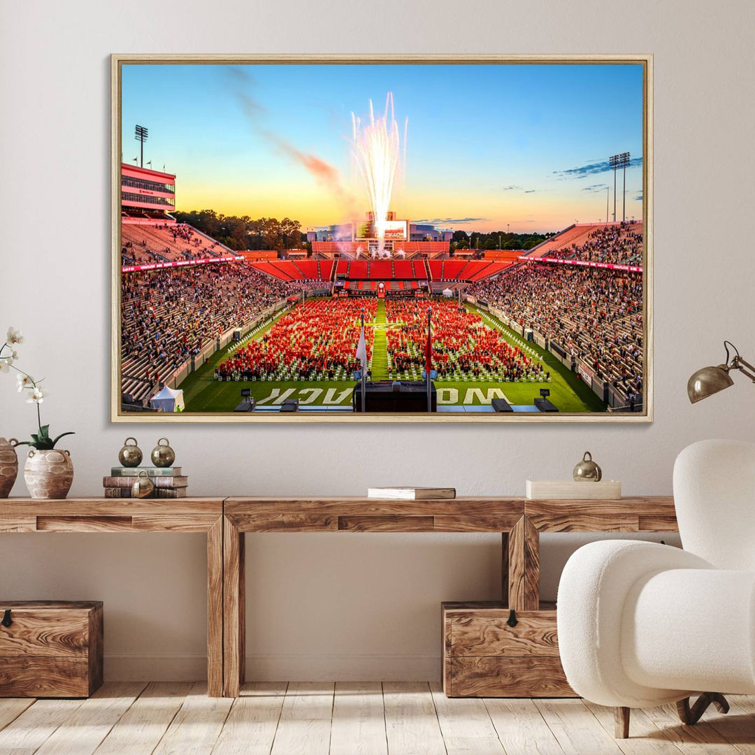 A vibrant North Carolina State University Wolfpack print, capturing a people-filled stadium, fireworks, and a sunset—perfect for your living room wall.