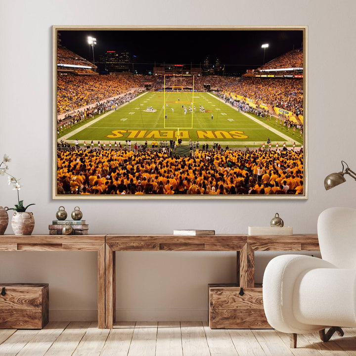 The Phoenix Stadium Canvas Wall Art features a vibrant depiction of a packed stadium filled with ASU Sun Devils fans wearing yellow shirts.