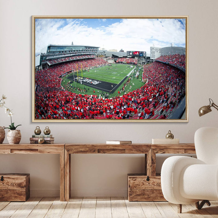 The wall showcases a Nippert Stadium canvas print of the Cincinnati Bearcats.