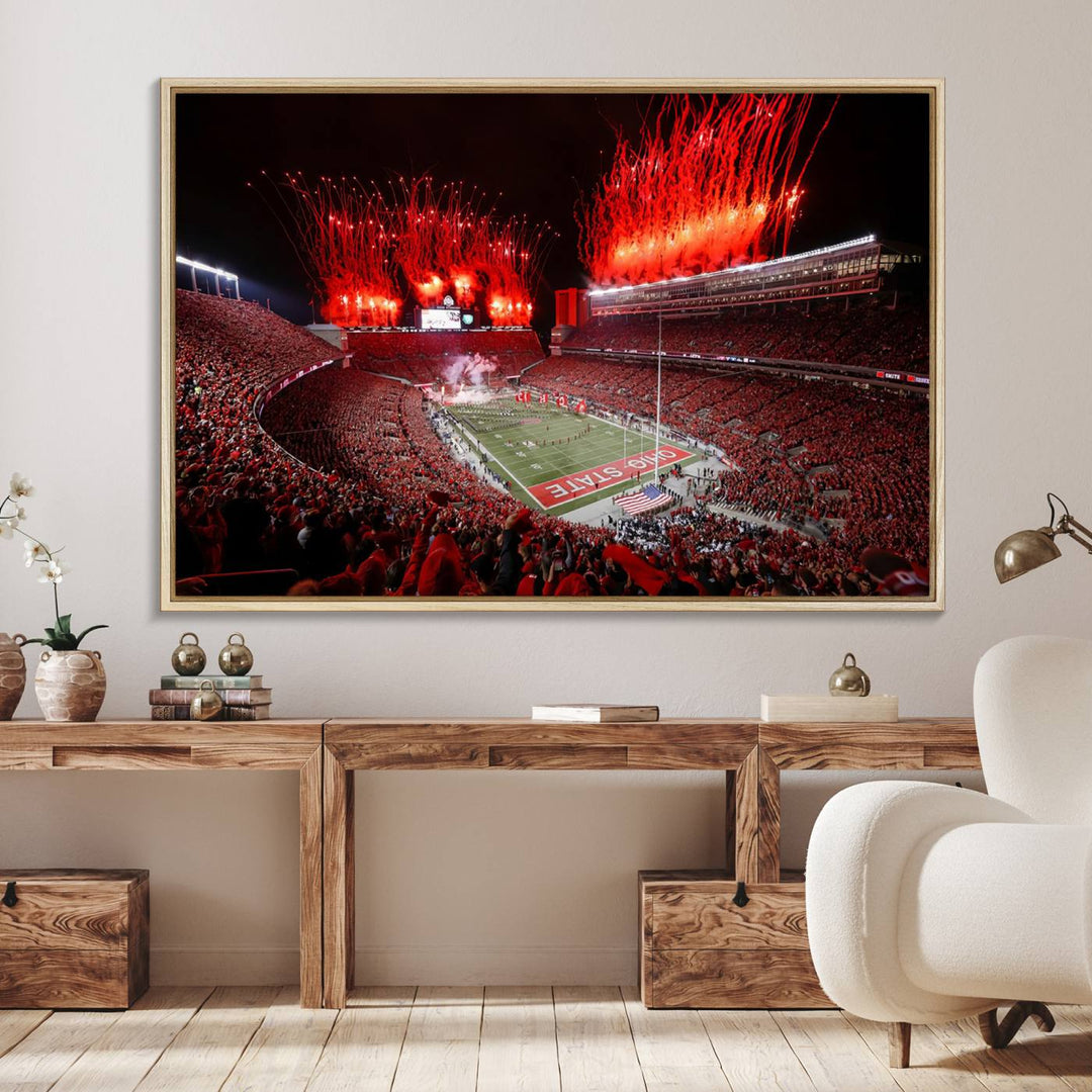 A vibrant red canvas art of a packed Ohio State Buckeyes stadium at night with fireworks.