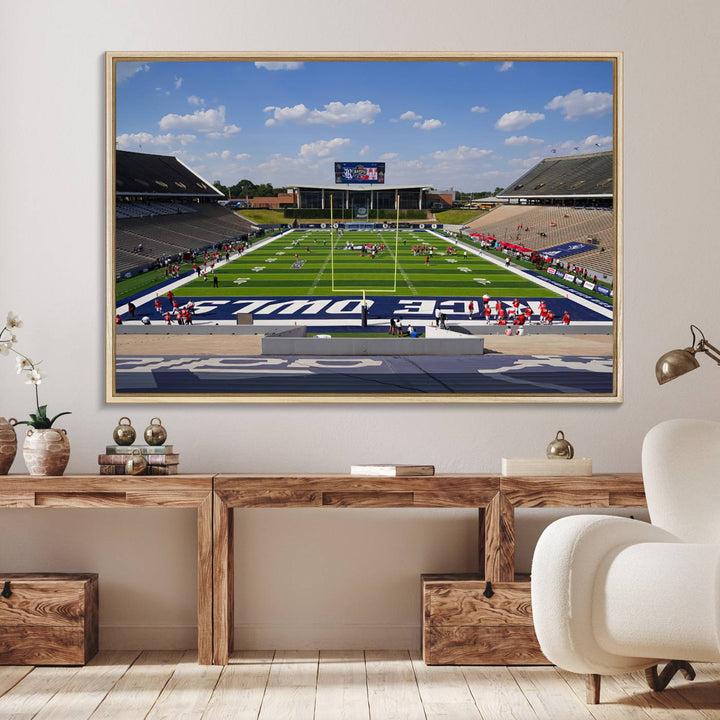 Rice Stadium print: This artwork features a football field with empty stands and a gallery-quality finish under a clear blue sky.