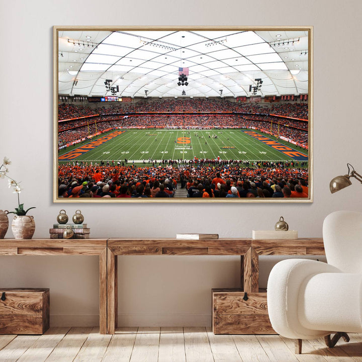 Fans fill the Syracuse JMA Wireless Dome, highlighted in orange and blue under a vaulted roof on this premium canvas print of the scene.