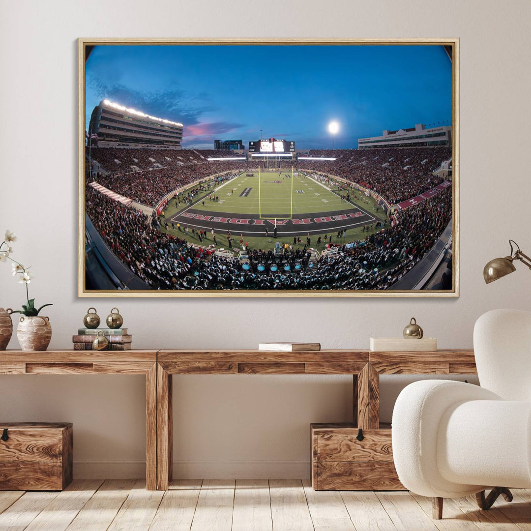 The wall art in the living room features a Texas Tech Red Raiders Football Team Print, showcasing Jones AT&T Stadium at dusk.