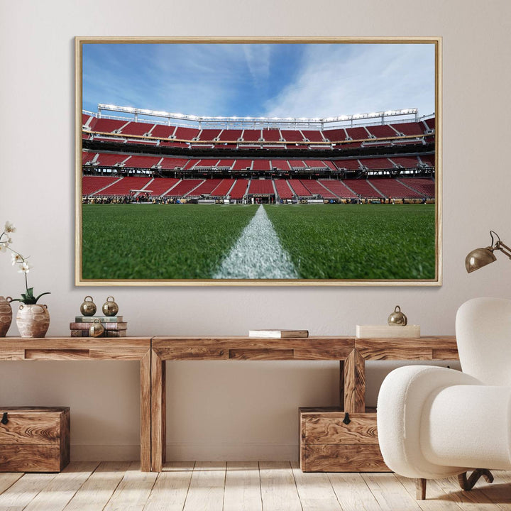 A canvas print of the University of Tulsa Golden Hurricane showcases H.A. Chapman Stadiums football field and red seats against a backdrop of a blue sky.