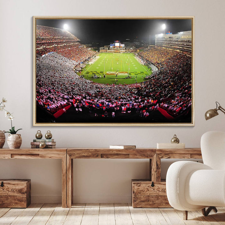 The Maryland Terrapins Football Wall Art Canvas showcases a packed SECU Stadium at night with a bright field and cheering fans.