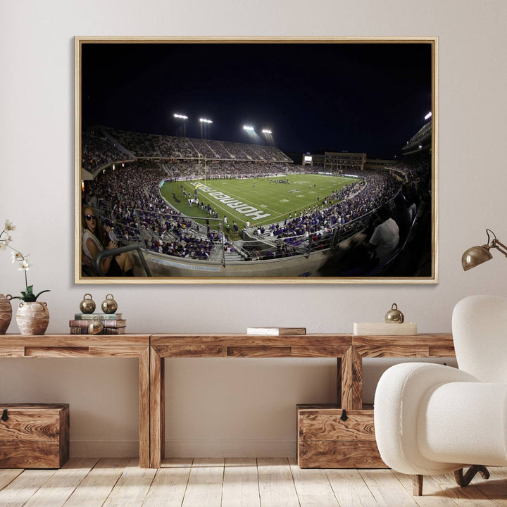 The wall art print features a night view of Amon G. Carter Stadium filled with TCU fans, showcased in the Horned Frogs Football Canvas Wall Art.