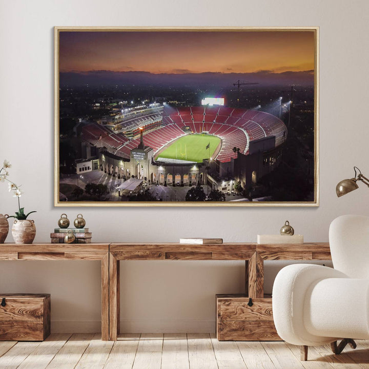 The USC Trojans Stadium canvas captures Memorial Coliseum at twilight, showcasing red seats and a green field beneath an orange sky.