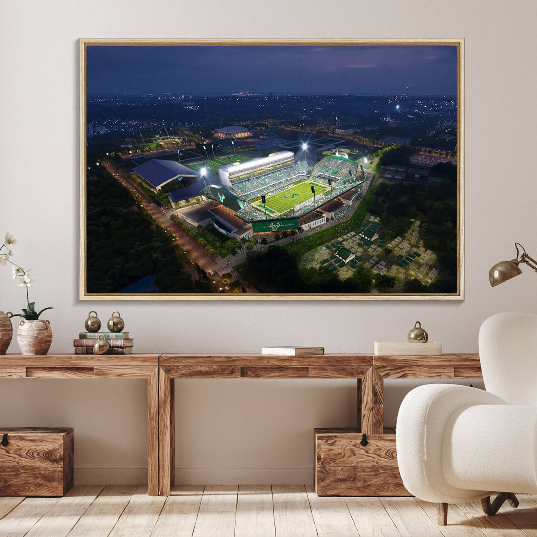 The USF Bulls Football Team Wall Art Canvas Print showcases the Tampa USF Football Stadium at night with city lights.